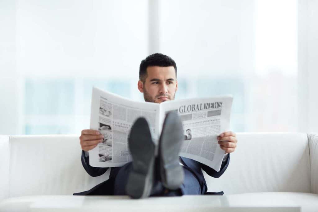 a successful businessman reading 